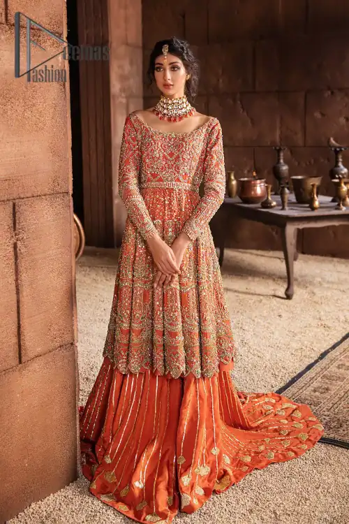 Fall in love with elements of detailing. Embrace your Mehandi style story with this orange attire serving vogue at its
