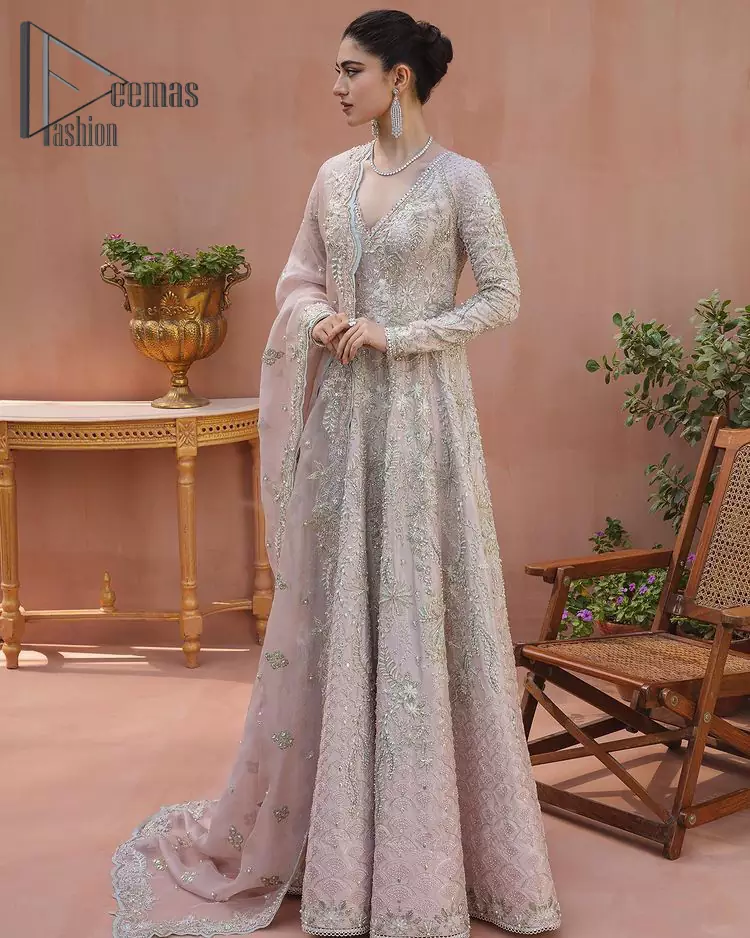 A true epitome of elegance. Confected ever so beautifully with the oyster pink colour palette and eye-catching embroidery. The ouster pink maxi is splendid just because of its multiple colour embroidery which is involved with tilla, dabka, kora and pearls. Further, it is prominent with its V shape neckline that grants pleasure to you on your walima day when combine with full sleeves. Complete this oyster pink outfit with a dupatta that is ornamented with embellished border and sequins spray just to fulfil your dream.