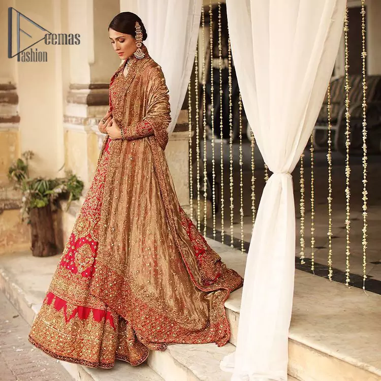 Dress up for your occasion, it's time to dance on your big day. Give a fresh twist to your wedding Big day outfits with this eye-catching red article. Reveal your day with the red heavy blouse that is attractively adorned with golden embroidery which includes tilla, dabka, kora work so that you can embezzle everyone's attraction. In addition to this, the sweetheart neckline of the blouse is just soothing when comes with full sleeves. The blouse is coordinated with a red lehenga that is heavily embellished with marvellous embroidery to give you a queen look. Complete this outfit with a golden dupatta which enhanced the beauty of the outfit.