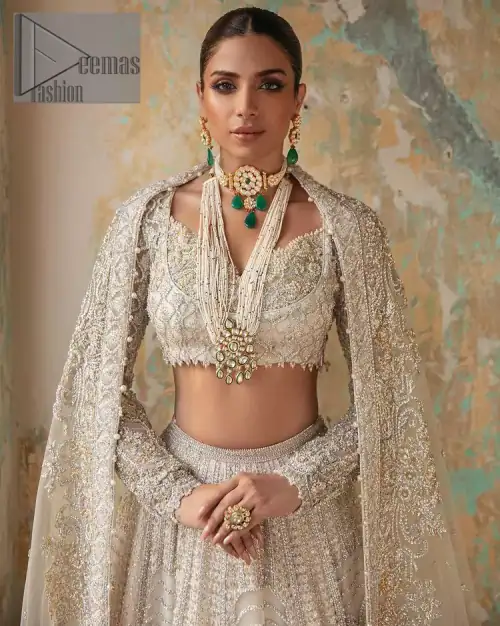 With a touch of Divine. A stunning ivory blouse is laboriously frosted with meticulously detailed hand embellishment with kora, dabka,