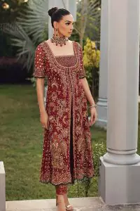 Just fulfil your love for maroon on your Big day with DeemasFashion. Giving you all the glam with this maroon scalloped front open frock which is beautifully sprinkled with antique tilla, dabka, kora, crystal, and Resham thread work. In addition to this, the square neckline and half sleeves with multicolor embroidery look so stunning and soothing on your Big day. It is attractively synchronized with cigarette pants to grant you a remarkable aesthetic focusing look.