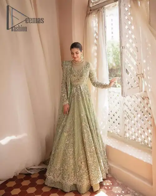 A time of life that is not just an occasion but a celebration. A pastel green scalloped maxi laboriously frosted