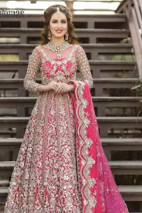A colour splash, a floral dream. Let your energy shine with this pink outfit. Make a dramatic entry with pink scalloped pishwas that's full sleeves look super-duper amazing when combine with boat shape neckline. It is streaking with the finest silver and light golden embroidery that counts in tilla, kora, dabka, and crystal work to give you an enthusiast look. Further, this scalloped pishwas is coordinated with a Pink dupatta that is adorned with four-sided borders and sequins spray all over to give you shiny energy at any party.