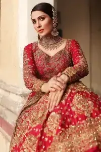 Dress up for your occasion, it's time to dance on your big day. Give a fresh twist to your wedding Big day outfits with this eye-catching red article. Reveal your day with the red heavy blouse that is attractively adorned with golden embroidery which includes tilla, dabka, kora work so that you can embezzle everyone's attraction. In addition to this, the sweetheart neckline of the blouse is just soothing when comes with full sleeves. The blouse is coordinated with a red lehenga that is heavily embellished with marvellous embroidery to give you a queen look. Complete this outfit with a golden dupatta which enhanced the beauty of the outfit.