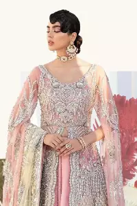 Wants regal, striking, and bold? Our tea pink maxi is all you need to bring out the queen in you. Detailing this tea pink maxi is as amazing as the front open style of maxi. Maxi is prominent with silver embroidery that involves kora, dabka, tilla, and crystal work to give you a bold and regal look on your walima day. Further, it looks super stunning when full sleeves combine with a round neckline. The maxi is coordinated with a double tone lehenga that the bottom side reflects the yellow colour to give an aesthetic and stunning look. Complete this article with the same colour dupatta that is embellished with a four-sided border.