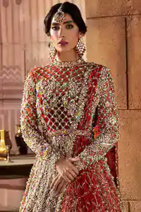 There are days in life when you fall in love with red love tone. As every bride wants red for her big day so DeemasFashion presents a bright red maxi that is heavily ornamented with golden embroidery just to make you a relaxing and romantic bride. The maxi is prominent with a jewel neckline which is added super aesthetics to your outfit. In addition to this, the full sleeves of maxi are just priceless and highlighted with kora, dabka, and tilla work. It is coordinated with the same colour lehenga that's the border is heavily embellished with golden embroidery as well. Conclude this outfit with a bright red dupatta to add just the right amount to your bridal look as a Pakistani bridal wear.