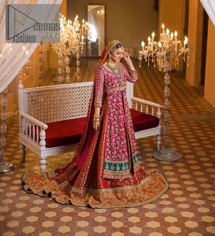 Do you also want to give you a look of the traditional brides on your Mehandi? Make your moment memorable being a queen in our magenta front open shirt with intricately embroidered neckline and embellished with delicate kora, dabka, tilla work all over. A green border of the shirt gives the perfect look to the outfit. It is organized with a red back train jamawar lehenga to give you the look of such a traditional bride. Complete this outfit with a red dupatta which is laboriously adorned with a four-sided border and ting floral motifs all over to give you such a super traditional Mehandi bride vibe.