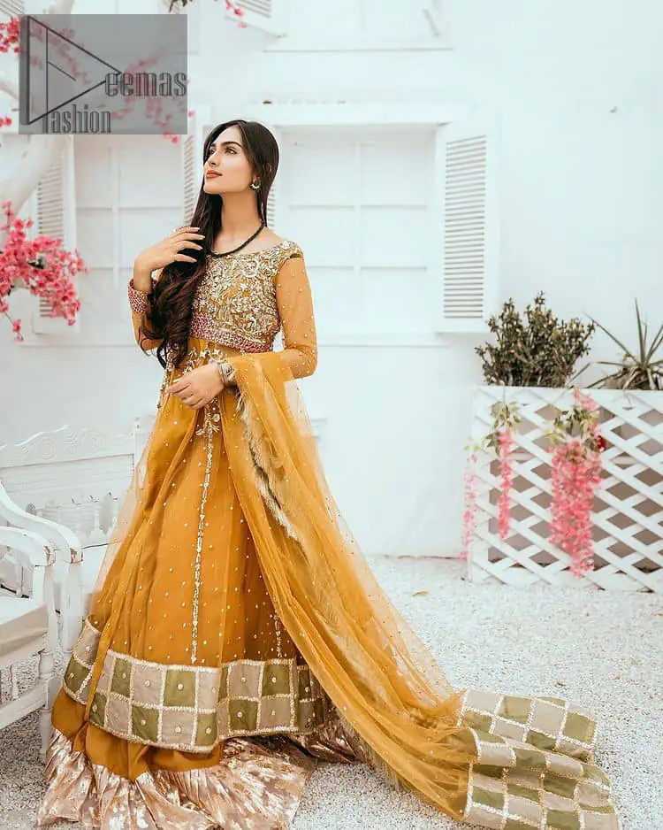 Mustard is just associated and boosts your Mehandi. Presenting a dreamy mustard frock with a heavily embroidered bodice on a