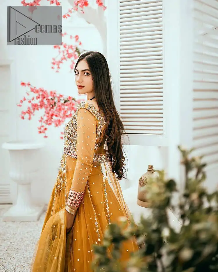 Mustard is just associated and boosts your Mehandi. Presenting a dreamy mustard frock with a heavily embroidered bodice on a