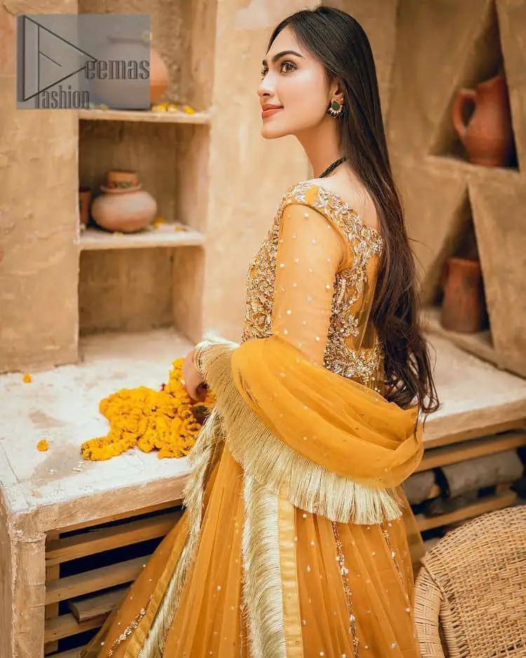 Mustard is just associated and boosts your Mehandi. Presenting a dreamy mustard frock with a heavily embroidered bodice on a