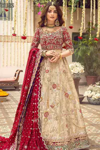 It's distinctive how the new-gen brides are welcoming red and beige shades for their bridal outfits as well. So welcome your guest to this charming beige lehenga. The three quarter-sleeved Red Blouse got it all for you.