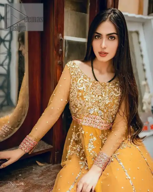 Mustard is just associated and boosts your Mehandi. Presenting a dreamy mustard frock with a heavily embroidered bodice on a