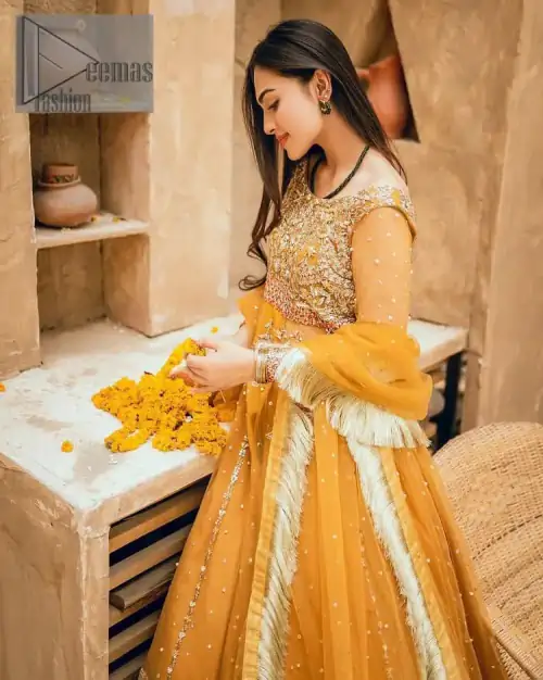 Mustard is just associated and boosts your Mehandi. Presenting a dreamy mustard frock with a heavily embroidered bodice on a