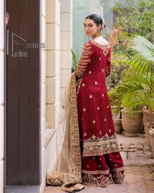 Embrace yourself with deep red on your big day. This deep red long shirt is meticulously hand-rendered with light golden