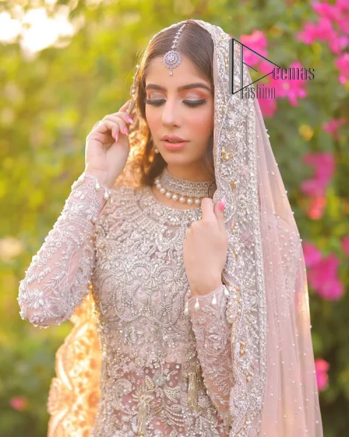 Introducing the mauve nikah outfit which begins with a short shirt that is meticulously and laboriously hand-rendered with silver embroidery