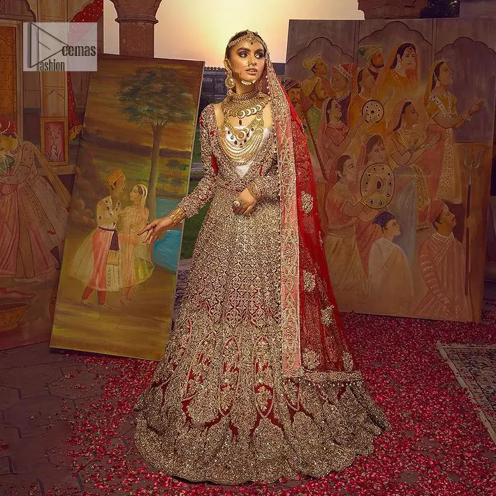 Encourage your reception day in this elegant yet classy deep red silhouette. Make your bridal look, in this deep red ensemble, heavenly adorned with golden embroidery highlighted with kora, dabka, zardozi,tilla, crystal, pearls and sequins. The heavily loaded embroidered border completes the look of the maxi. In addition to this, the V shape neckline along with full sleeves is such a graceful artistic look. It is paired up with this heavily loaded dupatta with intricately handcrafted borders, further enhanced with floral motifs and sequins spray all over to add a romantic and aesthetic look to this article.