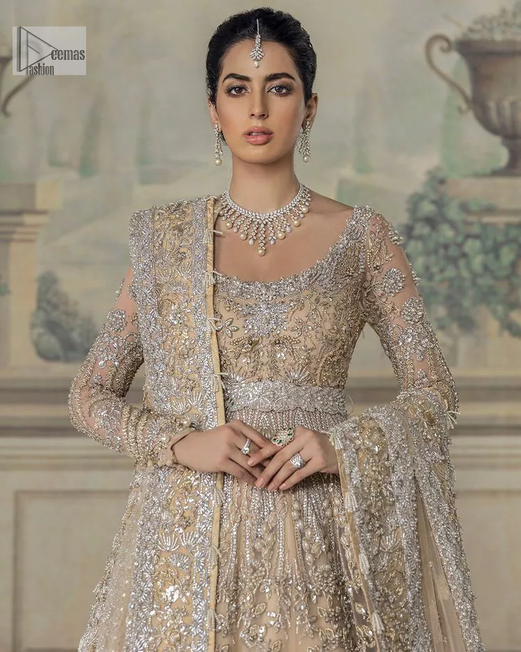 Beautiful fabrication and whimsical embroidery. What an absolute treat! The yellow maxi defines endless transitions of the intricate embellishment of silver embroidery, the patterns which portray a fusion of modern twists which enhances with tilla, dabka, zardozi, Resham and beautiful details of crystal. The round neckline of the maxi gives so soothing and romantic look when comes with full sleeves. The following maxi is beautifully systemized with can-can lehenga that is attractively adorned to make the outfit a unique masterpiece. Complete this article with the dupatta, framed with four-sided borders and sequins sprayed all over to meet the inner happiness of the bride.