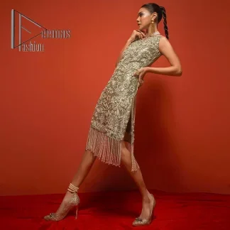 Celebrate your party events with DeemasFashion. An olive green shirt in tissue fabric, hand embellished with dabka, nakshi, cut dana, Resham, Swarovski, Mukesh, sequin and Kundan. A heavily embellished bodice featuring floral patterns all over to make your party event marvellous and shiny. The following heavy shirt is enhanced with V shape neckline along the sleeveless style. The bottom of the shirt has handsome fringes to give you a charming and splendid look.