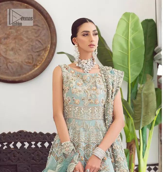 Be a fashion diva in this true modern classic Nikah outfit! The pale blue pleated maxi is handsomely adorned with multiple colour embroidery which is further enhanced with tilla, dabka, kora, Kundan and zardozi. The boat shape neckline makes a unique sense of the masterpiece when comes with sleeveless style. It is attractively organized with a dupatta in the same colour which is adorned with a four-sided border and enhanced with sequins sprayed all over to give you a modest look on your day.