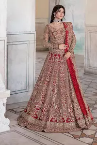 This intricate floral pattern is mirrored on a dreamy canvas to elevate your looks! The blouse in a bright red shade is a traditional attire to pair with a lehenga. The blouse is fully emblazoned with tilla, dabka, kora Kundan and crystals. Intricate designs and fine details of light golden embroidery give a perfect finishing look to the blouse. The boat shape neckline gives a stunning touch to the blouse. Further, Hand-crafted embellishments on full sleeves also add beauty to the outfit. It is systemized with can-can lehenga which is fully adorned with embroidery to fulfil the dreamy look. Finish this reception wear with a dupatta framed with four-sided embellished borders and sequins sprayed all over.