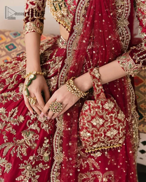 This outfit is a stand-out look for the Pakistani reception, this ensemble consists of a bright red-hued lehenga choli. This