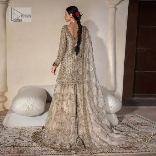 Unravel your inner density with our ivory nikah outfit. DeemasFashion presents this outfit which is embellished with light golden embroidery