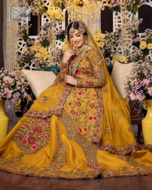 Take your style quotient up a few notches in this exquisite mehndi outfit! ]The maxi in mustard colour is a
