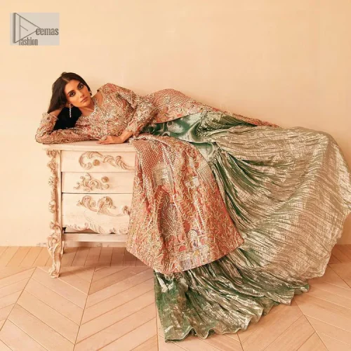 The latest elegant embroidered maxi in peach colour with magnificence embroidered work. The front open maxi is attractively laden with