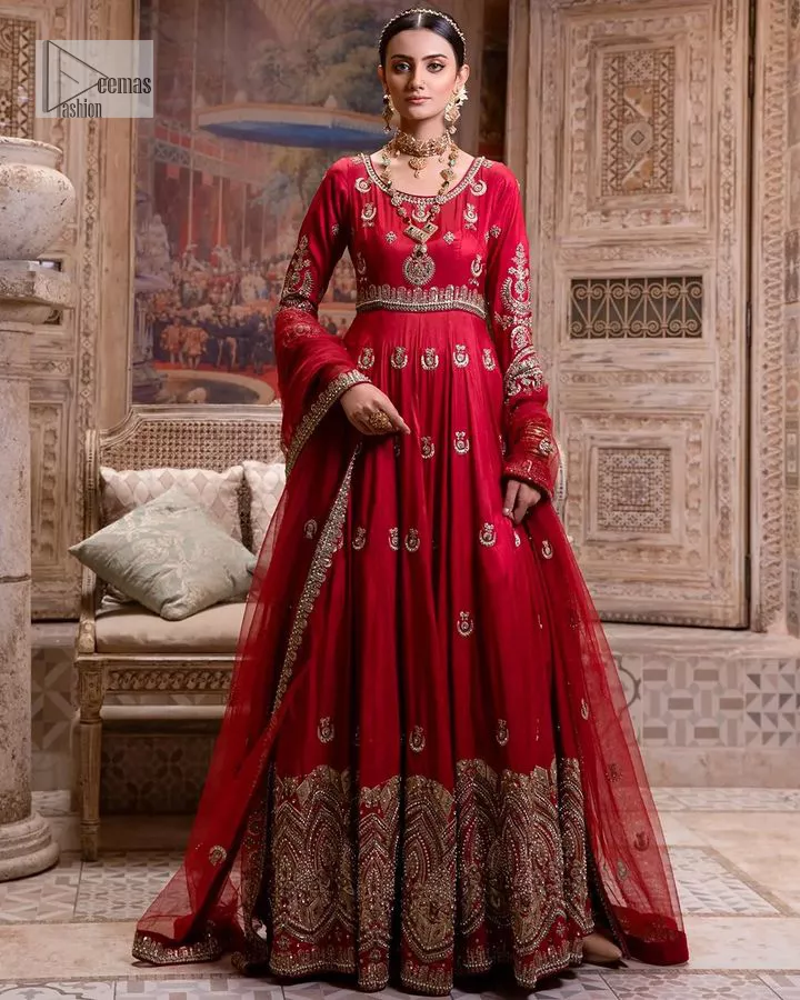 The traditional style is the new thing in the market. The stunning pishwas in the deep red shade is an eye-catching attire that gives you your desired dreamy appearance on your Big day. Beautiful work of zardozi, tilla, dabka, kora, Kundan, pearls, and beads make this attire an epitome of glamour and royalty. Embellished borders, as well as the bodice, gives an enchanting touch to this pishwas. Further, the round neckline of the outfit gives a royal touch. Further, fancy floral motifs are also adorned on the sleeves of this reception wear. It is organized with a dupatta framed with a four-sided border and sparkling tiny floral motifs all over.