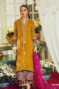 This mustard ensemble features zari and tilla details creating the perfect magical look for the season! The stunning long shirt in an alluring mustard shade comes in velvet fabric. The V-neckline of this shirt is emblazoned with embroidery and hand-crafted embellishments. Motifs, tilla, and threads give a perfect finishing look to the shirt. It is enhanced with multiple colours embroidered patches at the bottom to stole everyone's heart. It is paired with scalloped burgundy trousers to balance the overall look of this party wear. Complete this with a dupatta having tiny floral motifs and sequins sprayed all over.