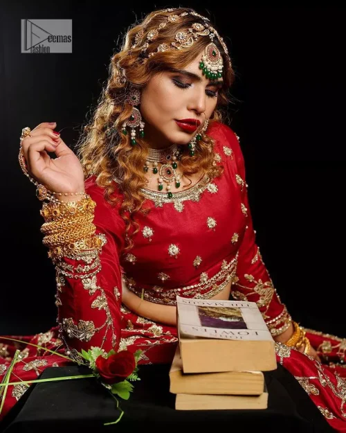 Reception called, and red answered. The stunning blouse is embellished with floral motifs. The base colour used for choli is