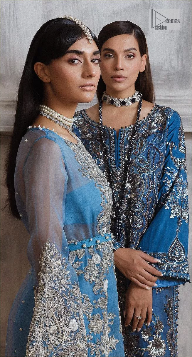 Dress up in this finest two-piece aesthetic party wear. A beautiful shirt in a cadet blue colour is a perfect choice to pair with trousers. The shirt is emblazoned with embroidery, threads, and floral designs. Hand-crafted details of tilla, dabka, Kora and Zardozi make this shirt a ravishing masterpiece. The round neckline is also decorated with attractive embroidery Furter, and the floral patterns on the sleeves give a handsome touch to the following shirt. It is systemized with plain ivory trousers to make a perfect combination which is a perfect choice.
