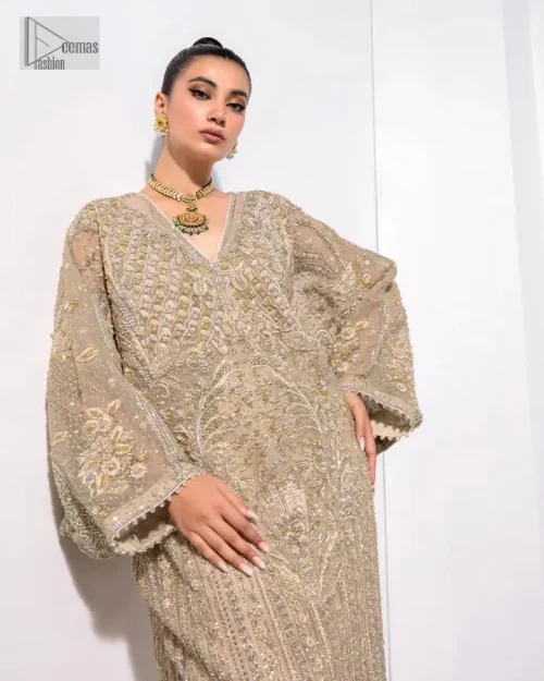 A little classy, a little sassy – that’s your style! An ivory floor-length kaftan with hand embellished work using dabka,