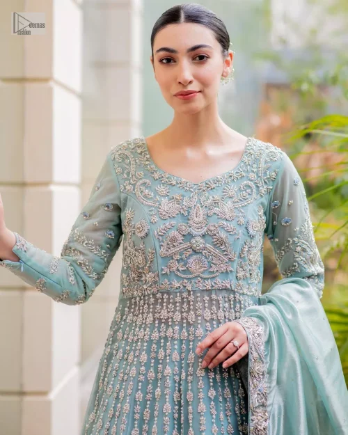 This attire showcases a harmonious fusion of traditional and modern design elements, adorned with intricate silver embellishments that include tilla,