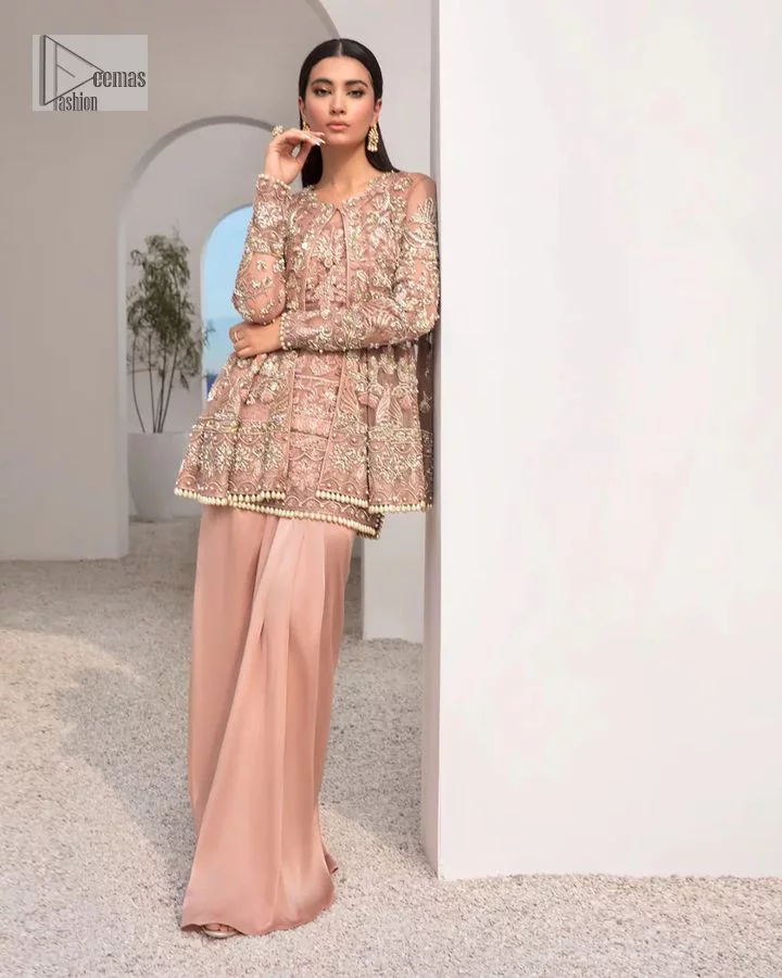 Rich shades and stunning details of party outfit – you’ll be making heads turn. A 2 pc outfit with a short front open shirt, full sleeves with floral pattern and embellishments on organza fabric; the asymmetrically placed designs are studded with golden and silver embroidery which is further highlighted with tilla, dabka, kora, Kundan and the intricate details of Zardozi. The embellished neckline has the finest details. It is paired up with the inner shirt that is also embellished to make this luxury attire unique. To complete the outfit the plain lehenga paired, just to fulfil your diva look.