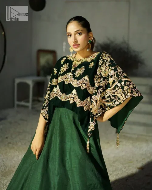 Style. Warmth. Performance & versatility!  This stuns in a beautifully handcrafted green top enshrined with light golden embellishment and detailed