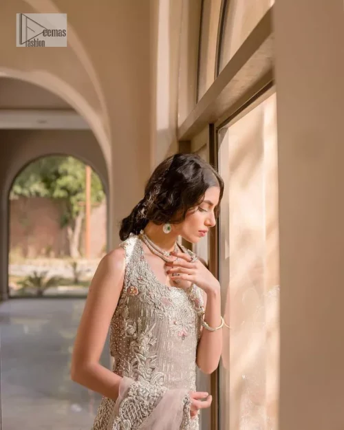 The beauty of idealism is captured with a touch of sparkle. This exclusive rose pink ensemble is beautifully translated on