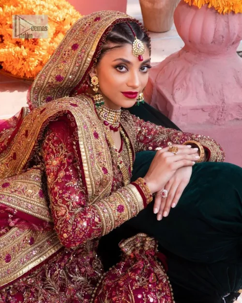 Deep shades of this reception wear just to brighten up your days. The deep red frock is intricately emblazoned with