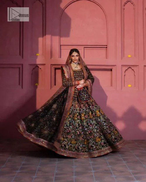 Make your superb days bright and bold! A jet black blouse with floral branches, peacock motifs and Mughal-inspired embellishments with