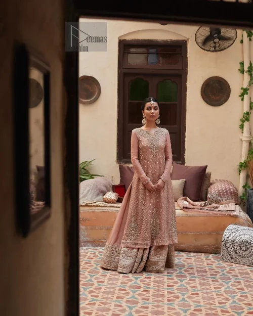 Introducing our exquisite Salmon Pink Nikah dress, a masterpiece designed to make your special day truly memorable. Crafted with utmost
