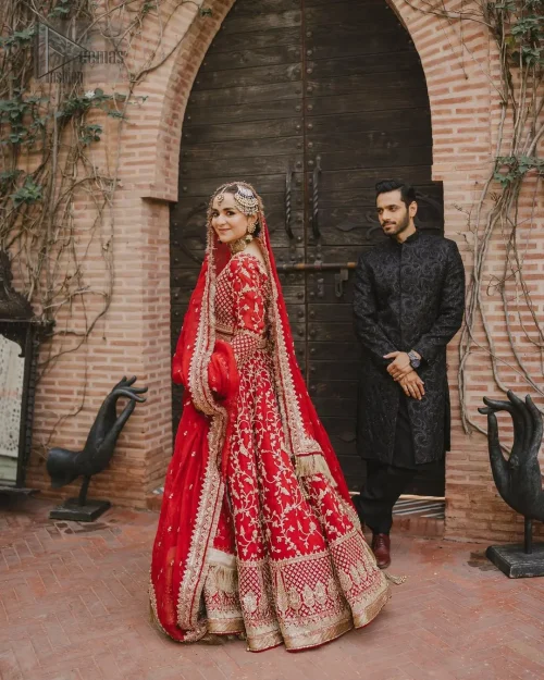 This unique dress is a masterpiece of design that involves light golden and bosky shades of embroidery having tilla, dabka,