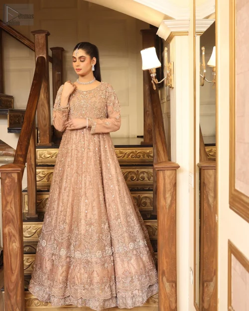 The luxurious Katan Banarsi Jamawar fabric envelops you in opulence while the embellished bodice glimmers with intricate silver and golden