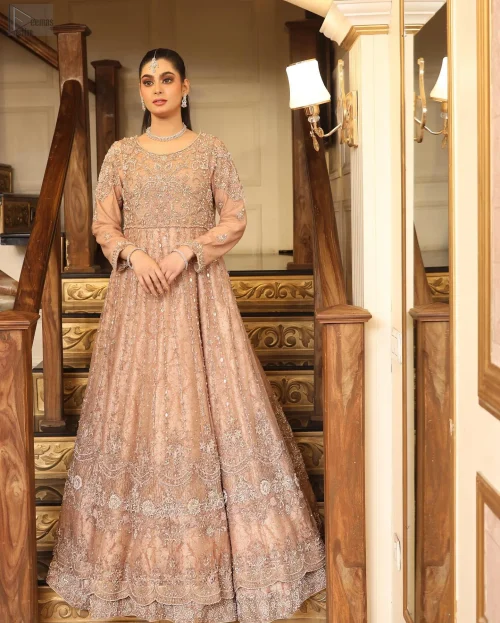 Luxurious Katan Banarsi fabric envelops you in opulence while the embellished bodice glimmers with intricate silver and golden embroidery.