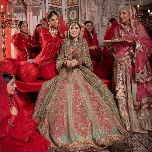 The sweetheart neckline blouse, in a delicate shade of pink, features intricate multiple-colour embroidery, adding layers of texture and charm.