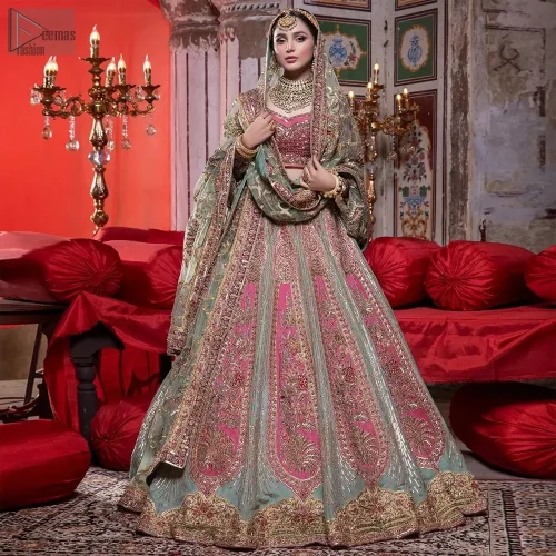 The flowing pistachio green lehenga, adorned with gotta work and applique, sways with every step,  while the net dupatta adorned