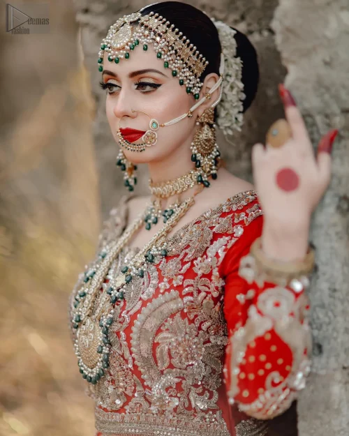 The scalloped dupatta drapes beautifully, completing the look with a hint of playful romance.