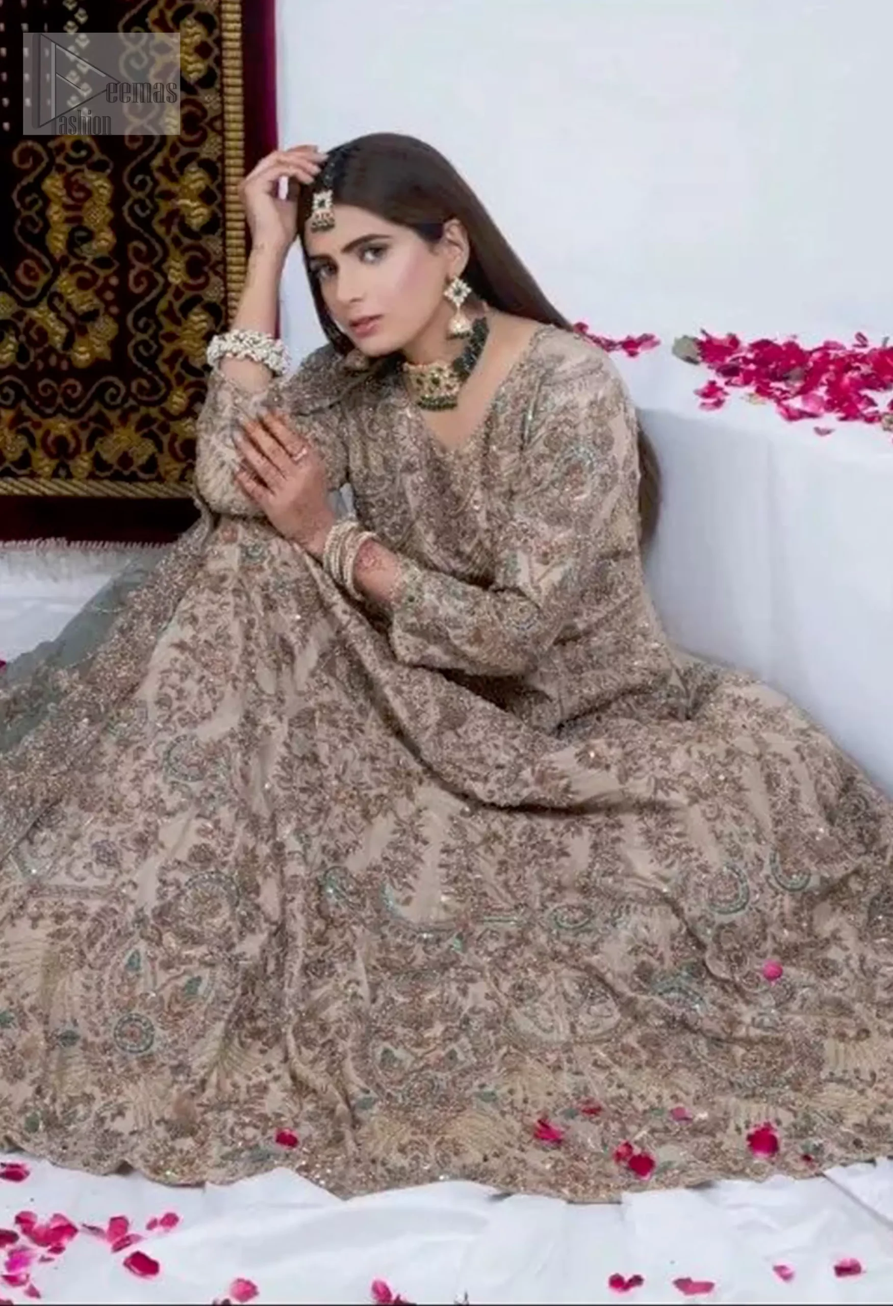 Crafted from the delicate net and organza, this maxi features intricate dark antique zardozi work and mint green thread embroidery, adding depth and texture.