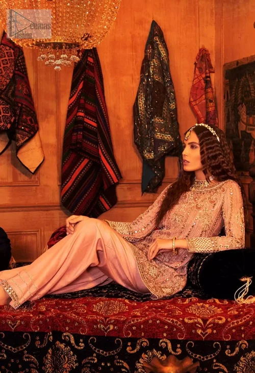 The stylish boat-shaped neckline and full sleeves create a sophisticated silhouette.