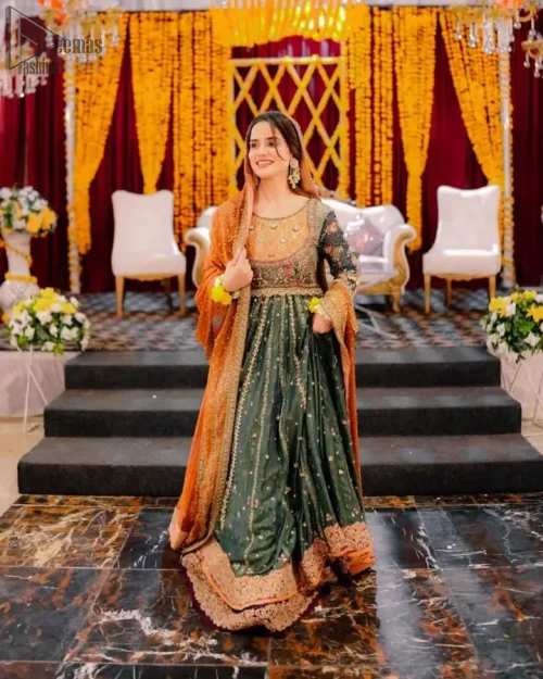 Rear view of the bottle green maxi and indigo paneled lehenga.