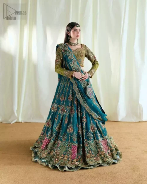 Olive banarsi blouse and teal double-layer Rajistaani lehenga for festive mehndi celebrations.